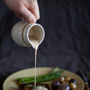 Bottle of Gourmet Inspirations Creamy Peppercorn Whisky Steak Sauce – rich, thick sauce with a hint of pepper heat.