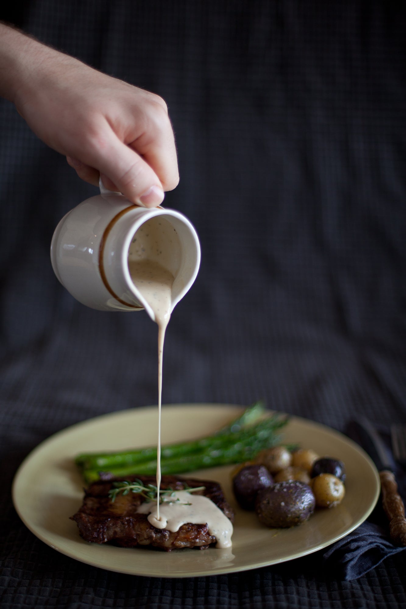 Bottle of Gourmet Inspirations Creamy Peppercorn Whisky Steak Sauce – rich, thick sauce with a hint of pepper heat.