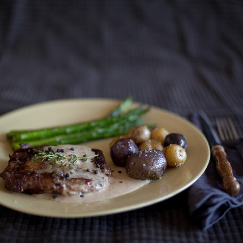 Bottle of Gourmet Inspirations Creamy Peppercorn Whisky Steak Sauce – rich, thick sauce with a hint of pepper heat.