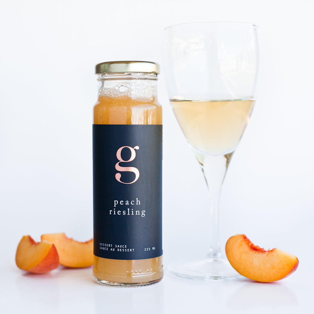 Jar of Gourmet Inspirations Peach Riesling Dessert Sauce – fruity and aromatic.