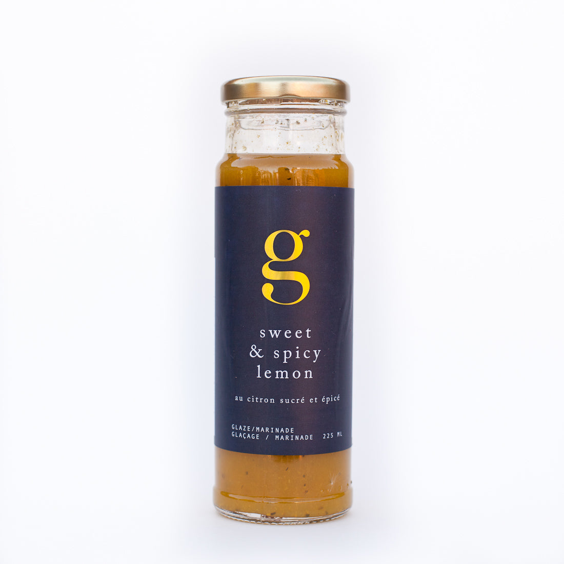 Bottle of Gourmet Inspirations Sweet & Spicy Lemon Glaze – tangy lemon flavor with a spicy kick.